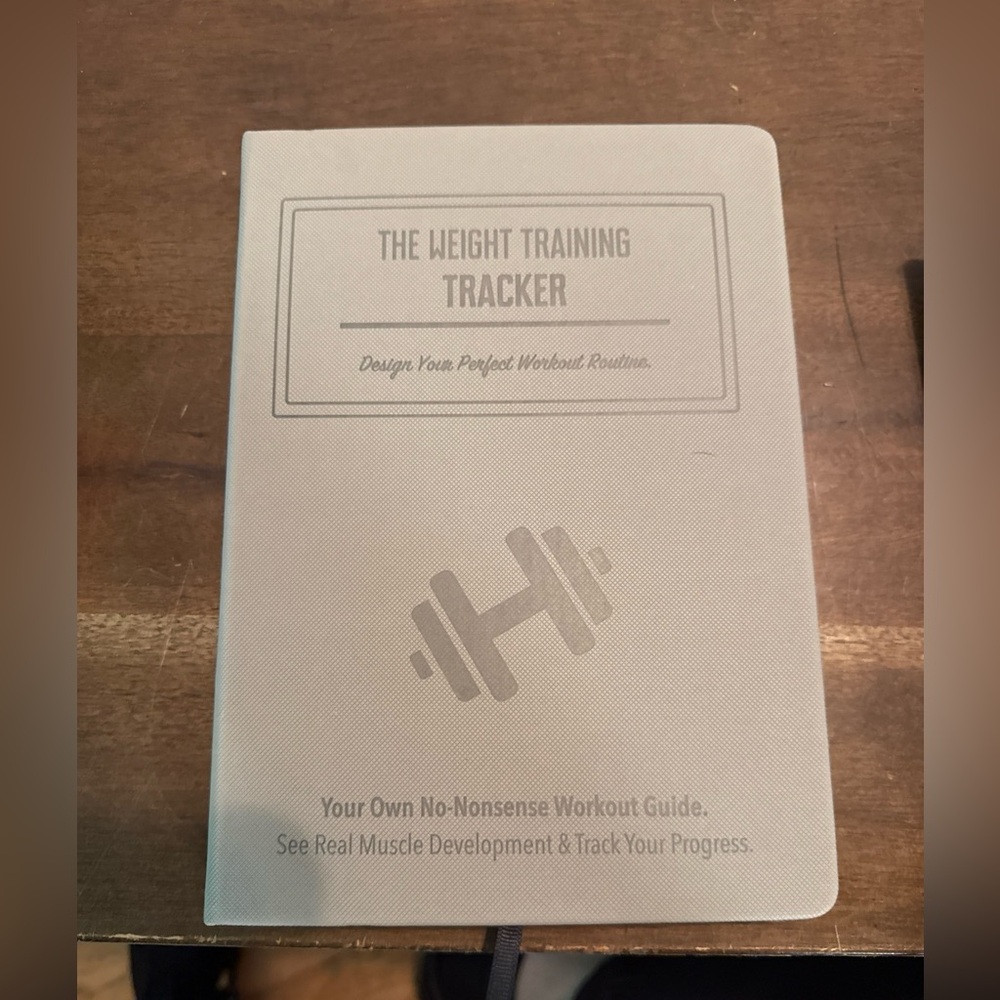 The Weight Training Tracker Journal Workout Guide by Habit Nest